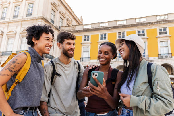 istock Cheerful tourists navigating with smartphone in lisbon, portugal 2201884632