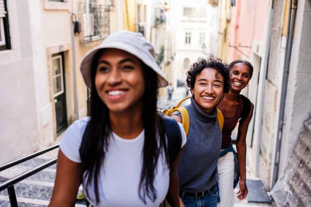 istock Three young women tourists exploring lisbon, portugal 2201884777