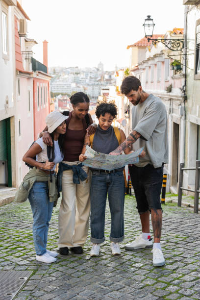 Tourists consulting map while exploring lisbon, portugal