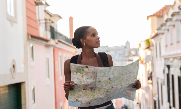 istock Tourist exploring lisbon, portugal, consulting a map 2201885627