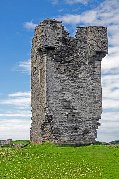 istock Ancient stone tower ruins under a bright blue sky in Ireland 2201885807