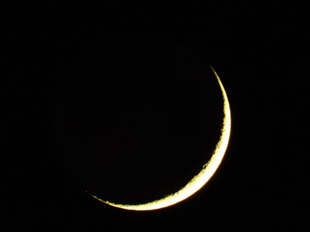 istock moon in waxing crescent phase on dark night sky 2201886254