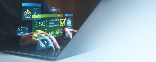 istock ESG digital concept with environmental, social, and governance metrics displayed as holograms over a laptop screen in a business context. 2201887712