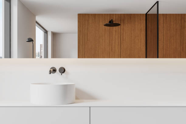 istock Modern minimalist bathroom with white sink and wooden accents. 3D Rendering 2201889015
