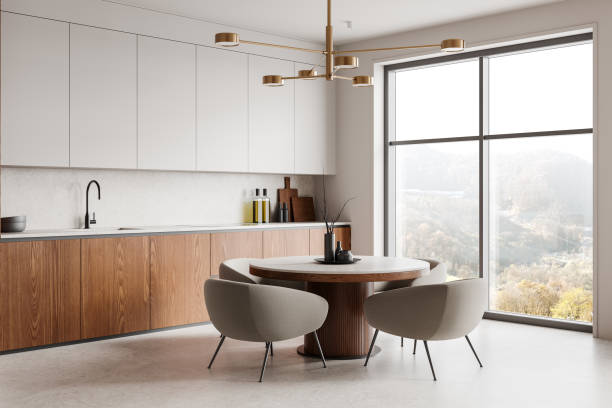 istock Elegant dining area with a modern table and mustard chairs in a bright kitchen space. 3D Rendering 2201889106