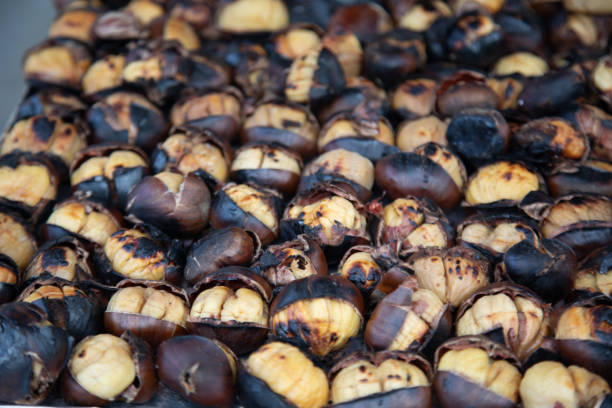 istock Istanbul, Turkey - February 21, 2025:  roasted chestnuts sold on the streets 2201889320