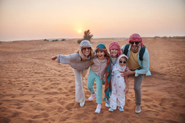 Beautiful family in Dubai desert. Vacation mood.