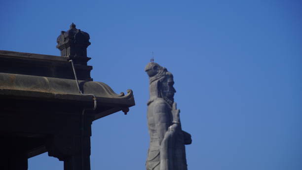 istock closeup shot of Thiruvalluvar statue with blue sky 2201890657