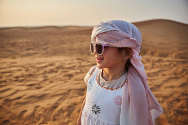 istock Beautiful girl in Dubai desert 2201890712