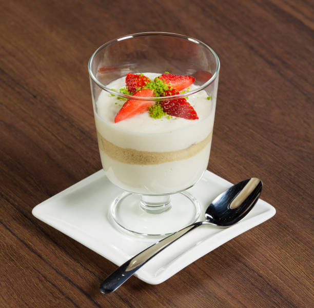 istock Strawberry dessert in glass on brown table 2201894912