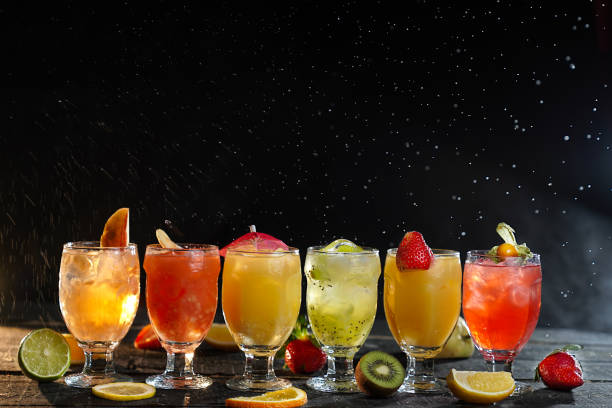 istock menu for a restaurant, bar map, lemonade in a glass, fruit drink from orange, cucumber, lemon, lime, orange, strawberries, raspberries, cherries, kiwi, beautiful serving, serving on a black background 2201896301