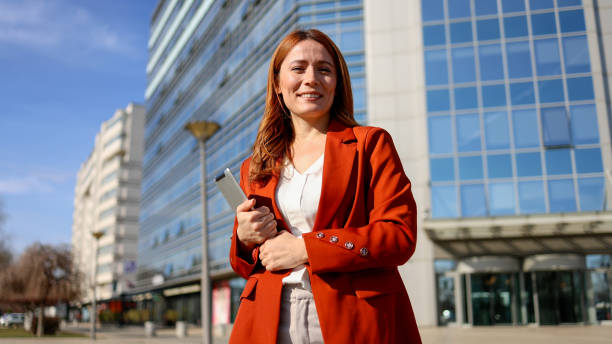istock Woman walking through the city after work 2201898933