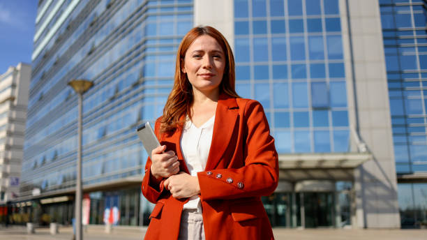 istock Woman walking through the city after work 2201898958