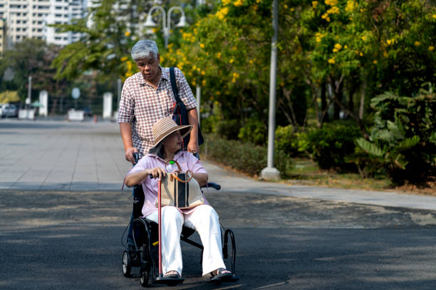 Caregiver pushing a wheelchair