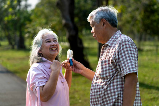 istock Senior couple enjoying a moment in park 2201899321