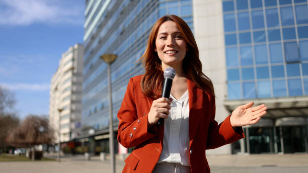 istock Journalist is delivering a live report from downtown 2201899745