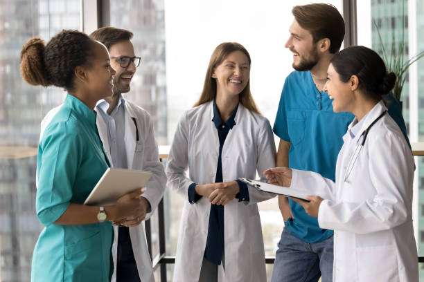 istock Clinic staff laughing, take break, engaged in friendly conversation 2201901348