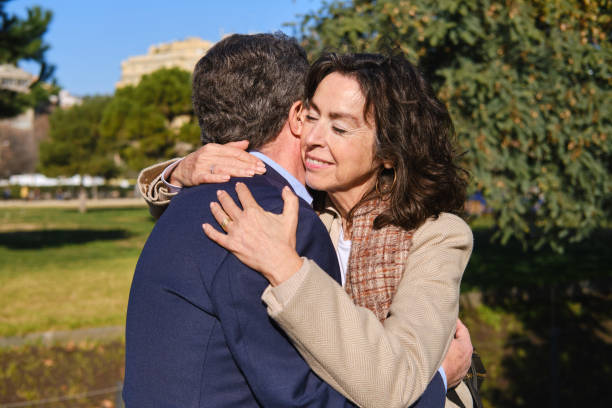 istock Senior couple embracing in barcelona park: expressing love and affection 2201902428