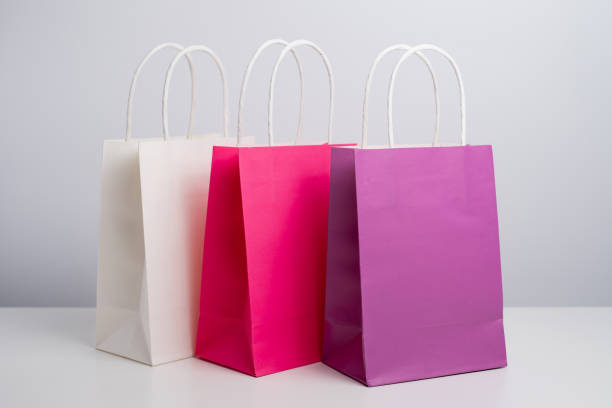 istock Color paper bag on a light background. Delivery and shopping concept. Packaging template mockup 2201905641