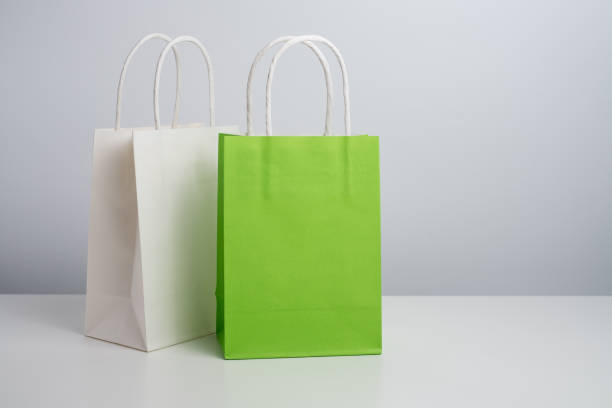 istock Color paper bag on a light background. Delivery and shopping concept. Packaging template mockup 2201905678