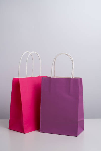 istock Color paper bag on a light background. Delivery and shopping concept. Packaging template mockup 2201905688