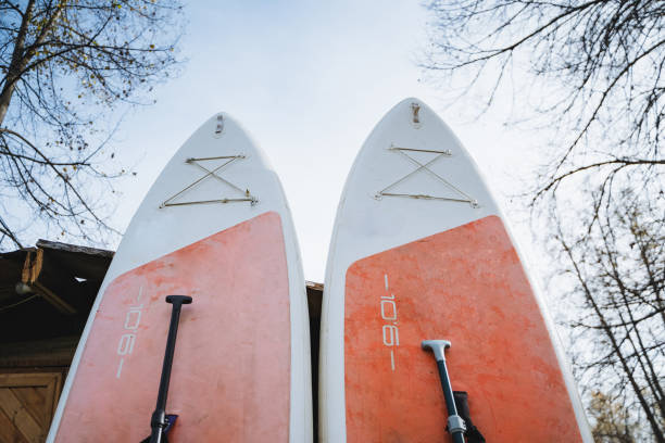 istock Two exquisitely decorated surfboards, both adorned with the letter k, eagerly await a thrilling day filled with adventure and enjoyment as they are ready to take on the waves ahead 2201910501