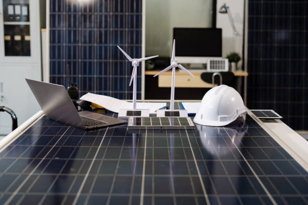 istock Profession concept with architect desk and tools on a wooden table. top view mock-up. green energy and solar panel concept. 2201910601