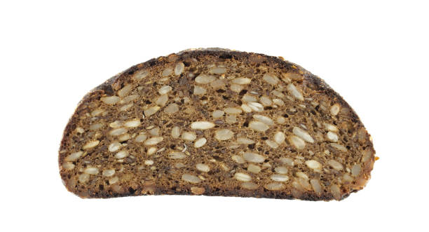 A detailed view of a slice of dark seeded bread shows its rich texture and wholesome nature.