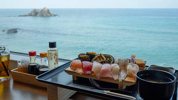 Sushi on the sushi bar in front of the sea view