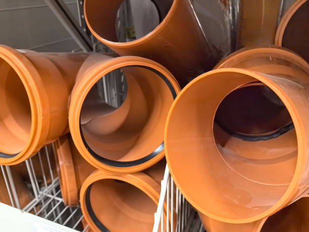 istock Colorful drainage pipes stacked artistically in a home improvement store 2201911963