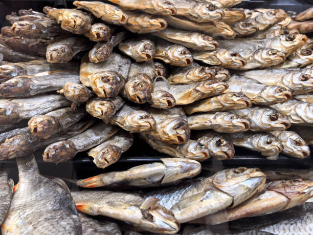 istock Dried fish arranged in a colorful display at a bustling market stall 2201912022