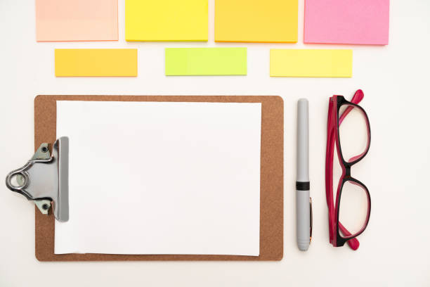 istock Multiple Assorted Collection Office Stationery Photo With Pens Pencils Notepads Notebook Ruler Stapler Scissors Clippers Paper Clips Holders Clipboard Placed Over Table 2201912432