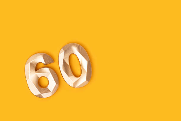 istock Golden number sixty on a yellow background. 2201914847