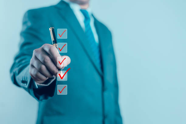Business Performance Checklist Businessman Using Laptop Doing Online Checklist Survey On Computer Filling Out Digital Form Checklist Survey Doing Assessment Questionnaire Evaluation