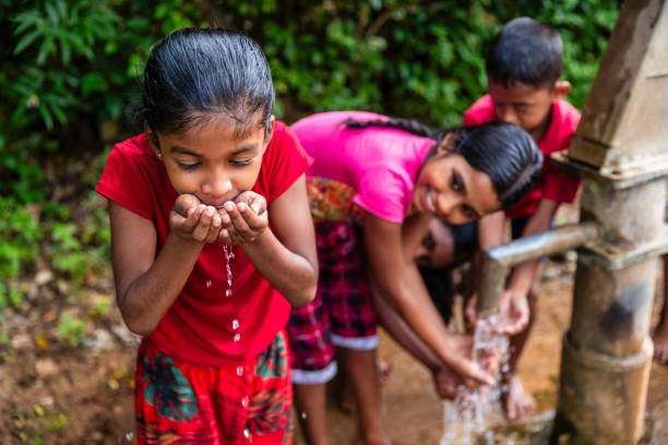 istock Sri Lankan children drinking a water, Ceylon 2201915359