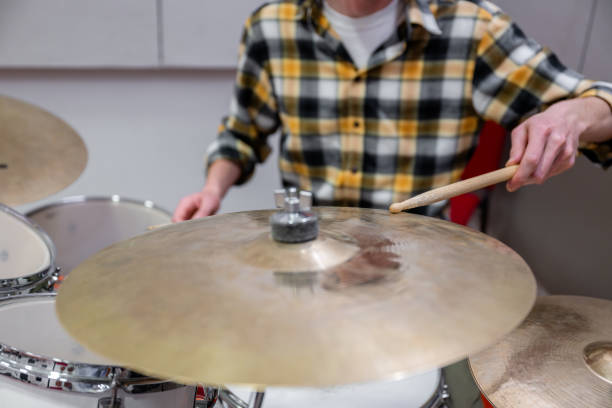 istock Drummer hitting cymbal with drumstick in Soundproof Recording Studio 2201915963