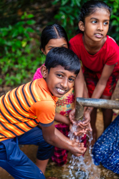 istock Sri Lankan children drinking a water, Ceylon 2201916100