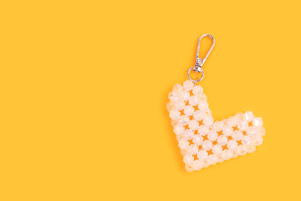 istock Keychain in a heart shape made from transparent shiny beads. 2201916541