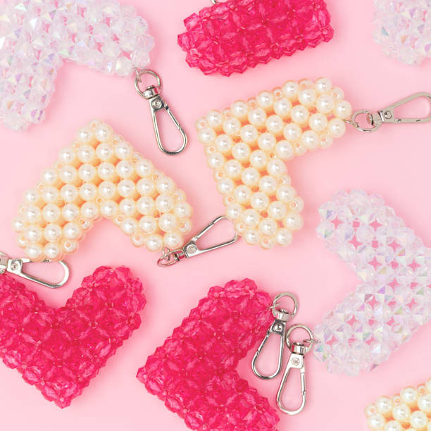 istock Multicolored handmade keychains in a heart shape made from acrylic beads. 2201916815