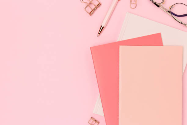 istock School supplies and eyeglasses on a pink background. 2201916833