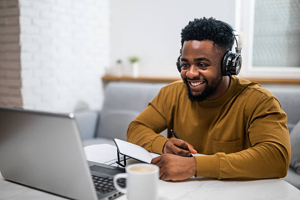 istock Happy African-American man attending online education class at home 2201917424