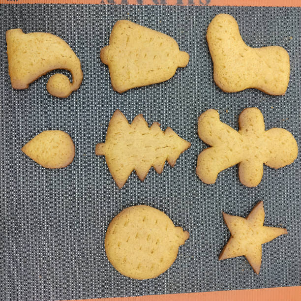 Christmas-Themed Cookies on Textured Mat