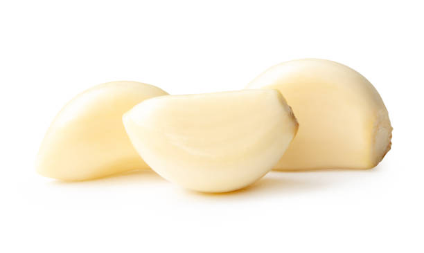 istock Side view of peeled garlic cloves or pieces in stack isolated on white background with clipping path 2201919212
