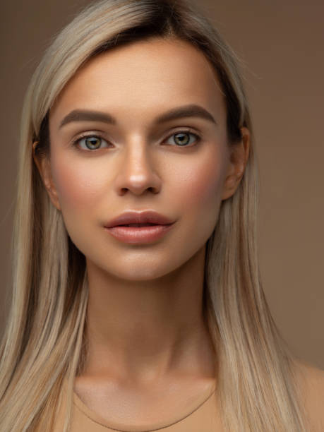 istock Young woman posing in studio with clean makeup and long blonde hair 2201920232