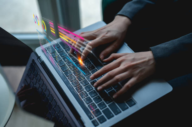 istock A person types on a laptop, engaged in work or creative tasks, with a focus on technology and productivity in a modern environment. 2201920260