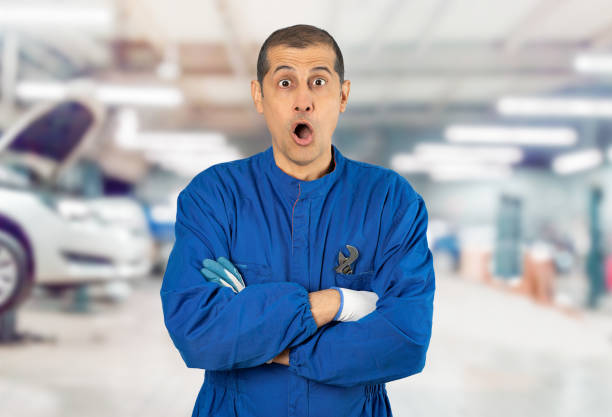 istock mechanic uniform scared in shock with a surprise face, afraid and excited with fear expression 2201920308
