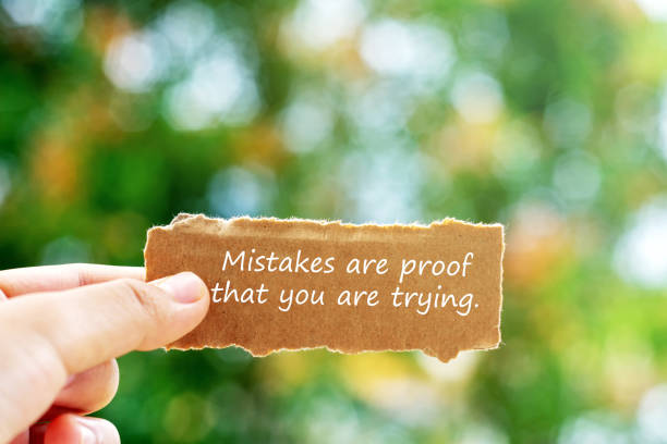 istock Hand holding a piece of paper with inspirational quotes 2201928257