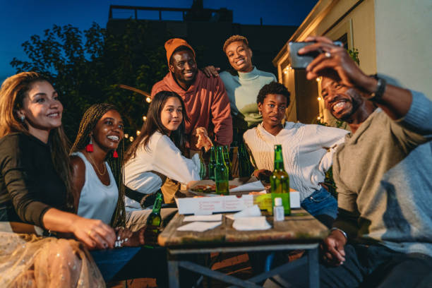istock Selfie time during a dinner party with friends 2201928497