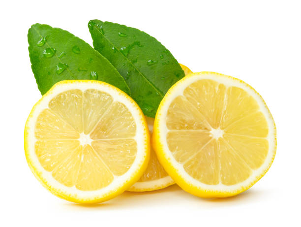 istock Front view of ripe yellow lemon fruit or slices in three circles with green leaves isolated on white background with clipping path 2201929644