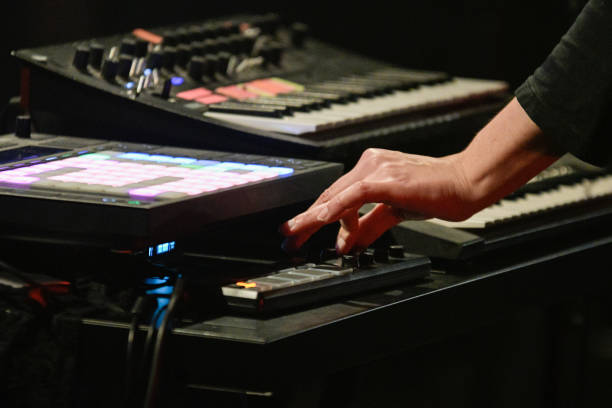 istock DJ Mixing Live – Hand Adjusting Synthesizer Knob 2201929695